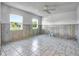 Bedroom with wood paneling and tile flooring at 7685 Ceres Dr, Orlando, FL 32822