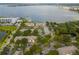 Aerial view of lakefront apartment community with lush landscaping and parking at 7524 Seurat St # 12301, Orlando, FL 32819