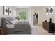 Main bedroom with a comfortable bed, plenty of natural light, and a walk-in closet at 7524 Seurat St # 12301, Orlando, FL 32819