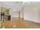 Open living room and kitchen with hardwood floors and an open concept at 7524 Seurat St # 12301, Orlando, FL 32819