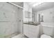 Updated bathroom with a walk-in shower, marble tile, and modern vanity at 7524 Seurat St # 12301, Orlando, FL 32819