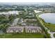 Aerial view of apartment community with lakefront access and resort-style amenities at 7524 Seurat St # 12301, Orlando, FL 32819