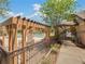 Community pool with pergola, seating, and gated entrance at 7524 Seurat St # 12301, Orlando, FL 32819