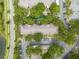 Aerial view of apartment buildings with playground, parking and surrounding trees at 7524 Seurat St # 12301, Orlando, FL 32819