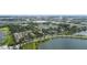Aerial view of community near a lake with surrounding landscape and city view in the distance at 7524 Seurat St # 12301, Orlando, FL 32819