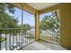 Private screened balcony overlooking a lake and parking area at 7524 Seurat St # 12301, Orlando, FL 32819