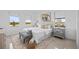 Main bedroom with plush bedding, large windows, and a neutral color palette at 6311 Chorus Dr, Mascotte, FL 34753