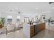 Open concept kitchen with island, modern cabinetry, and stainless steel appliances at 6311 Chorus Dr, Mascotte, FL 34753