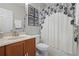 Clean bathroom with a shower/tub combo and a floral shower curtain at 570 Pinebranch Cir, Winter Springs, FL 32708