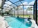 Enjoy this refreshing pool with screened enclosure and plenty of seating at 13333 Early Frost Cir, Orlando, FL 32828