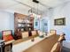 Elegant dining room featuring a large wooden table and hutch at 13333 Early Frost Cir, Orlando, FL 32828