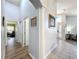 Bright hallway with tile flooring and access to multiple rooms at 13333 Early Frost Cir, Orlando, FL 32828