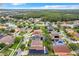 Neighborhood overview with houses, roads, and a lake at 13333 Early Frost Cir, Orlando, FL 32828