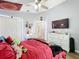 Cozy bedroom featuring a full-size bed, TV, and dresser at 13333 Early Frost Cir, Orlando, FL 32828