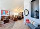 Bright and spacious living room with hardwood floors and a view into the dining area at 13333 Early Frost Cir, Orlando, FL 32828