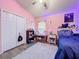 Charming bedroom with a unique decor, plush rug, and a full-size bed at 13333 Early Frost Cir, Orlando, FL 32828