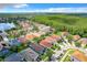 Community overview showing houses and a lake at 13333 Early Frost Cir, Orlando, FL 32828