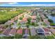 Neighborhood overview, showcasing houses, roads, and a lake at 13333 Early Frost Cir, Orlando, FL 32828