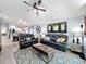 Bright and airy living room with comfortable leather seating and kitchen views at 13333 Early Frost Cir, Orlando, FL 32828