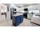 Updated kitchen featuring a blue island and ample cabinetry at 13333 Early Frost Cir, Orlando, FL 32828