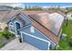 Blue house with solar panels on roof, viewed from above at 13333 Early Frost Cir, Orlando, FL 32828
