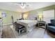 Spacious bedroom with large bed, ceiling fan, and ample closet space at 13333 Early Frost Cir, Orlando, FL 32828