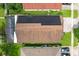 Aerial view showing house with solar panels, pool, and landscaping at 13333 Early Frost Cir, Orlando, FL 32828