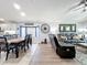 Open concept dining room features a spacious table with seating for six and is adjacent to the kitchen at 13333 Early Frost Cir, Orlando, FL 32828