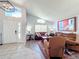 Spacious living room with hardwood floors, neutral walls, and comfy seating at 13333 Early Frost Cir, Orlando, FL 32828