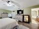 Spacious main bedroom with plush bedding and large dresser at 13333 Early Frost Cir, Orlando, FL 32828