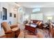Living room with leather sofas and a large rug at 13333 Early Frost Cir, Orlando, FL 32828