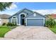 Two-car garage and paver driveway at 13333 Early Frost Cir, Orlando, FL 32828