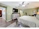 Bright bedroom with a large TV, dresser, and comfortable bed at 13333 Early Frost Cir, Orlando, FL 32828
