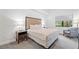Main bedroom with king-size bed and window seat at 14501 Grove Resort Ave # 3134, Winter Garden, FL 34787