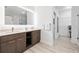 Modern bathroom with double vanity and walk-in shower at 14501 Grove Resort Ave # 3134, Winter Garden, FL 34787