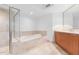 Double vanity bathroom with modern wood cabinets and a soaking tub at 231 Riverside Drive # 1209-1, Holly Hill, FL 32117