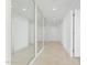Bright and spacious entryway with mirrored walls and tile flooring at 231 Riverside Drive # 1209-1, Holly Hill, FL 32117