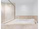 Relaxing bathroom with a large soaking tub and tiled shower at 231 Riverside Drive # 1209-1, Holly Hill, FL 32117