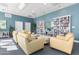 Spacious community room boasts ample seating and a large bookcase at 231 Riverside Drive # 1209-1, Holly Hill, FL 32117