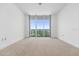 Spacious bedroom with large windows and city views at 231 Riverside Drive # 1209-1, Holly Hill, FL 32117