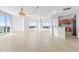 Bright and spacious living room with tile floors and large windows at 231 Riverside Drive # 1209-1, Holly Hill, FL 32117