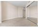 Well-lit bedroom featuring wall-to-wall carpet and mirrored closet doors at 231 Riverside Drive # 1209-1, Holly Hill, FL 32117