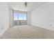 Bright bedroom with large windows and city views at 231 Riverside Drive # 1209-1, Holly Hill, FL 32117
