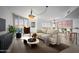 Bright living room with city views, featuring a comfortable sofa and stylish coffee table at 231 Riverside Drive # 1209-1, Holly Hill, FL 32117