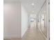 Bright hallway with tiled floors and mirrored walls at 231 Riverside Drive # 1209-1, Holly Hill, FL 32117