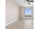Bedroom with tiled floor, large window, and city view at 231 Riverside Drive # 1209-1, Holly Hill, FL 32117