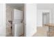 Laundry closet with shelving and stackable washer/dryer at 231 Riverside Drive # 1209-1, Holly Hill, FL 32117