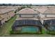 Aerial view of house with pool and community at 8829 Corcovado Dr, Kissimmee, FL 34747