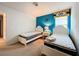 Bright bedroom with two twin beds, blue accent wall, and ample natural light at 8829 Corcovado Dr, Kissimmee, FL 34747