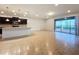 Open concept living area with kitchen, tile floors and access to pool area at 8829 Corcovado Dr, Kissimmee, FL 34747